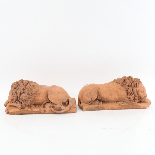 418 - A pair of composition recumbent lion sculptures, length 32cm