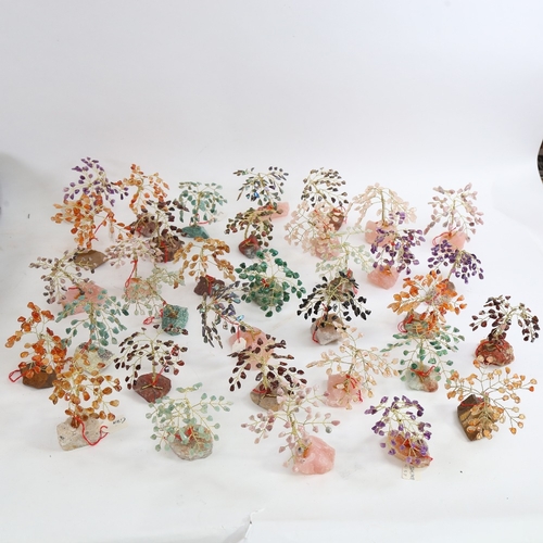 426 - A group of carved and polished hardstone and gemstone wirework trees, mostly 8cm and 9cm tall (boxfu... 