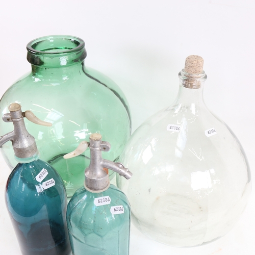 446 - 2 large glass carboys, and 2 Vintage soda syphons, largest jar height 36cm (4)