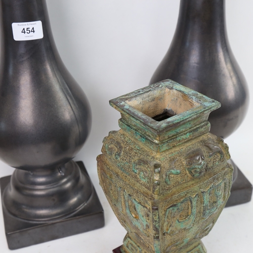 454 - A Chinese Archaic style verdigris vessel vase, and a pair of glazed ceramic candle stands, height 50... 