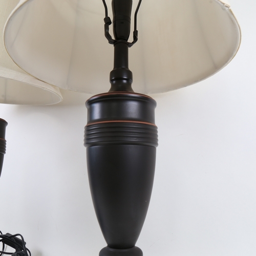 468 - A pair of Antique style black painted metal urn lamps and shades, overall height 74cm