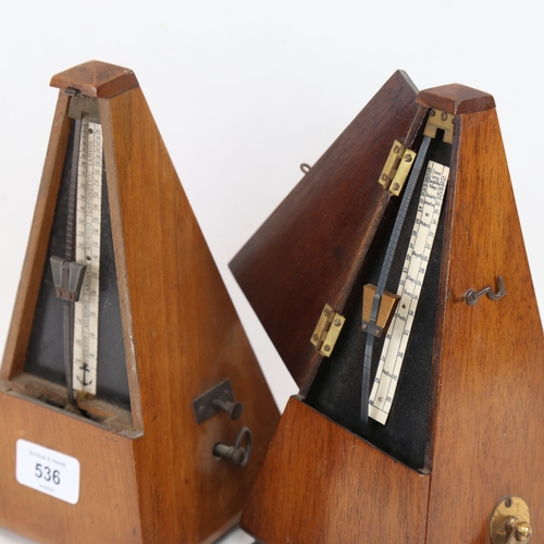 536 - 2 Vintage metronomes, height 23cm