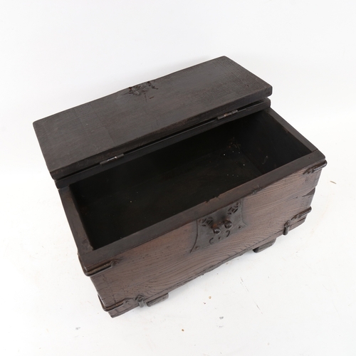 537 - A small scale stained oak table-top metal-bound trunk, W40cm, H23cm, D26cm