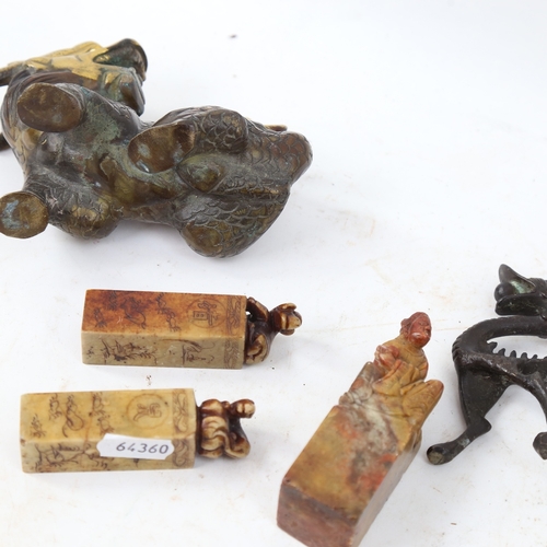 568 - A patinated bronze seated Kylin, carved soapstone seals etc (5)