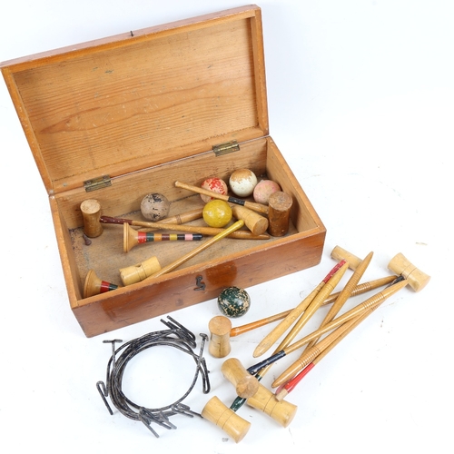 620 - A Vintage boxed game of table croquet, with mallets and balls