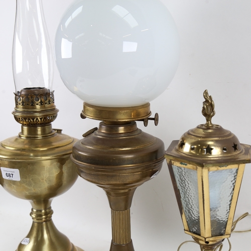 687 - A Vintage brass duplex oil lamp, with milk glass shade and glass funnel, another similar, and a lant... 