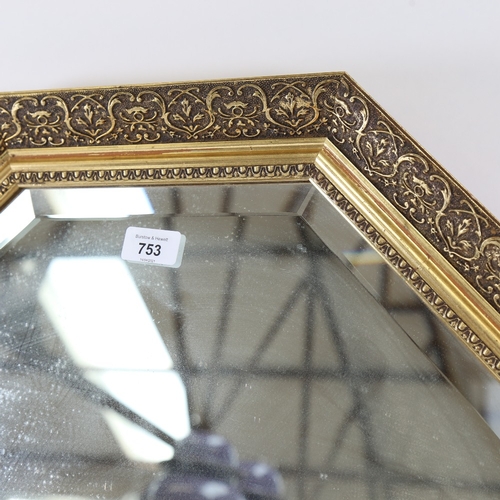 753 - An octagonal gilt-framed bevel-edge wall mirror, width 60cm