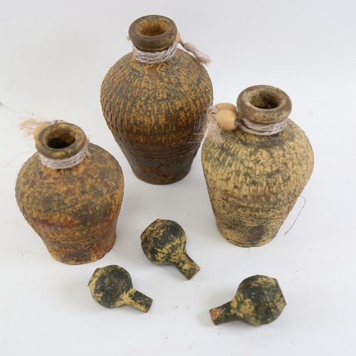 775 - A graduated set of 3 Antiquity style oil jars and stoppers, largest height 19cm (3)