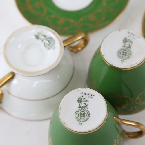 803 - A Royal Doulton gilded green ground coffee service