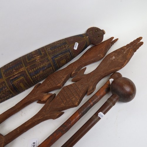 838 - An African Tribal hardwood knobkerry, a Chinese bamboo walking cane, African Tribal ceremonial paddl... 