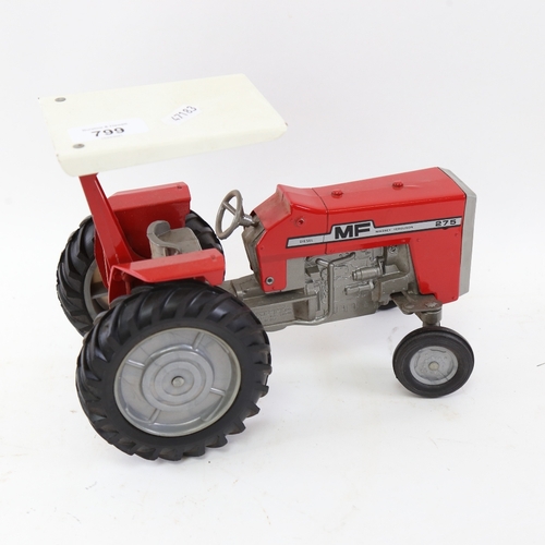 799 - An Ertl & Co Massey Ferguson diesel toy tractor, and a notebook (2)