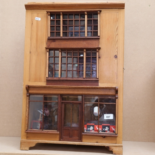 897 - A Vintage pine 3-storey doll's dress shop, with various furniture and fittings