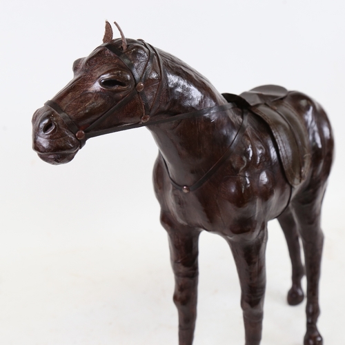 932 - A Vintage leather-covered model horse, length 48cm, height 41cm