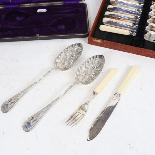 1212 - A cased pair of silver plated berry spoons, and a cased fish eating set for 6 people