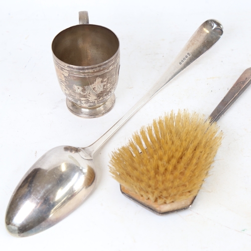 1282 - A silver christening tankard, silver-backed dressing table hair brush, and a silver plated gravy spo... 