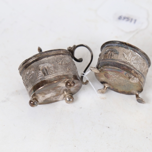 1289 - An early 20th century Indian unmarked silver 2-piece cruet set, comprising mustard pot and salt cell... 