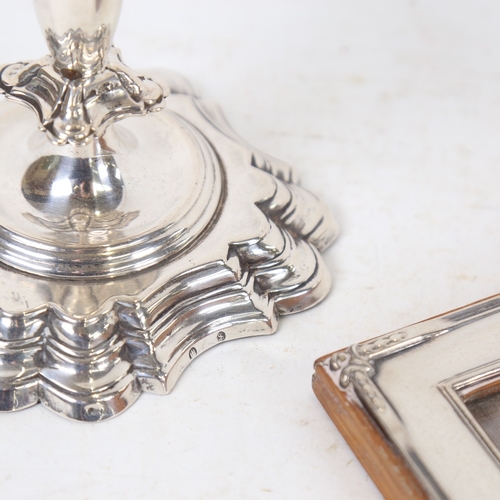 1262 - An unmarked silver rectangular photo frame, and a Danish silver squat candlestick (2)