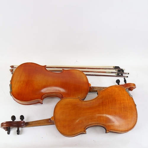 891 - A 20th century violin, and a viola, with 3 bows, in double instrument hardshell case