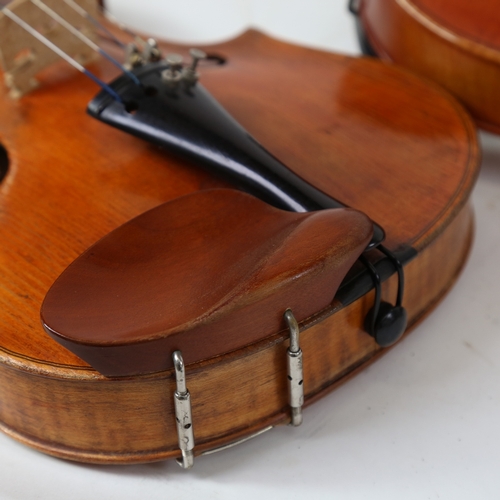 891 - A 20th century violin, and a viola, with 3 bows, in double instrument hardshell case