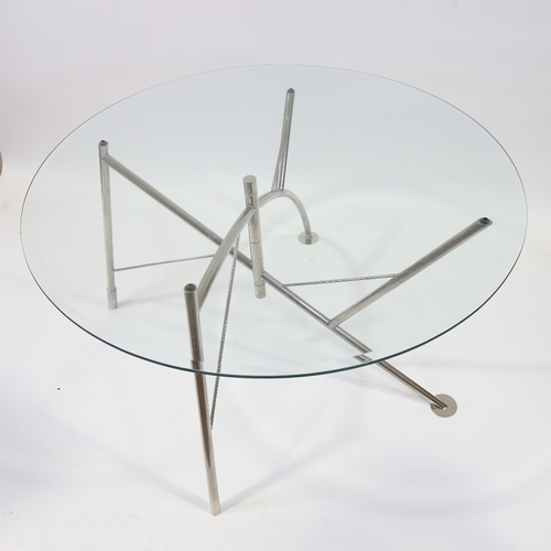 2054 - PHILIPPE STARCK, a Dole Melipone dining table by XO, with circular glass top and folding nickel plat... 