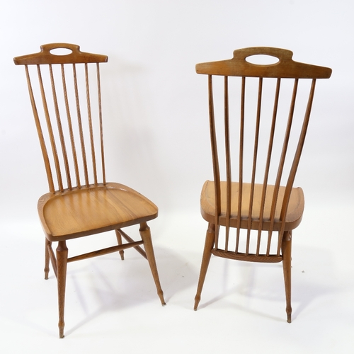 2076 - A pair of 1950s' Danish chairs, with blade form spindles, sculpted top rail and solid seat, height 1... 