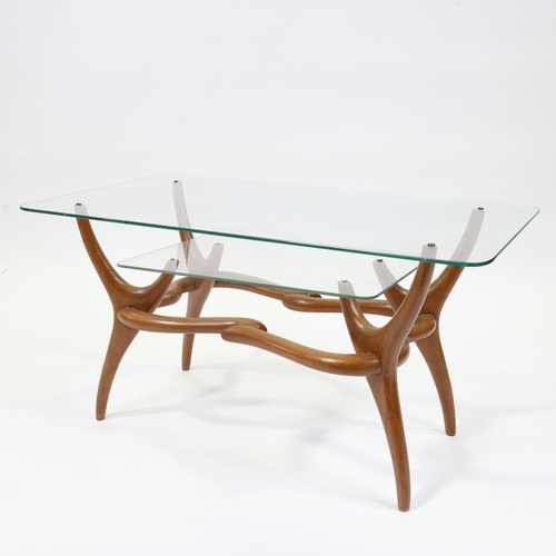 2009 - A mid-century Italian 2 tier glass coffee with organic sculptural base in walnut in the manner of PI... 
