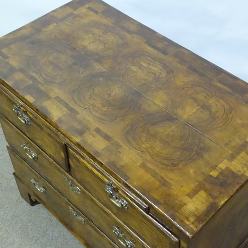 180 - An 18th century figured walnut bachelor's chest of drawers, with brushing slide, ornate multi-panel ... 