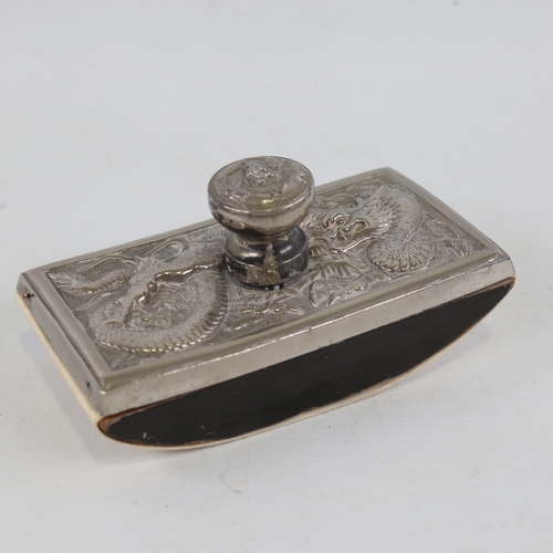 191 - A Chinese nickel-plate desk blotter, circa 1900, with relief dragon design, length 13.5cm