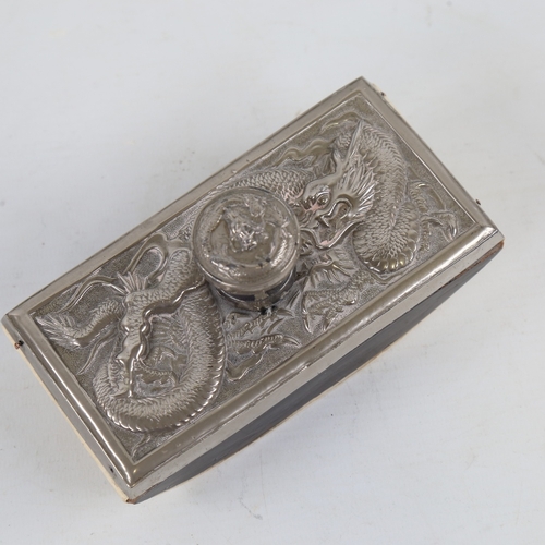 191 - A Chinese nickel-plate desk blotter, circa 1900, with relief dragon design, length 13.5cm