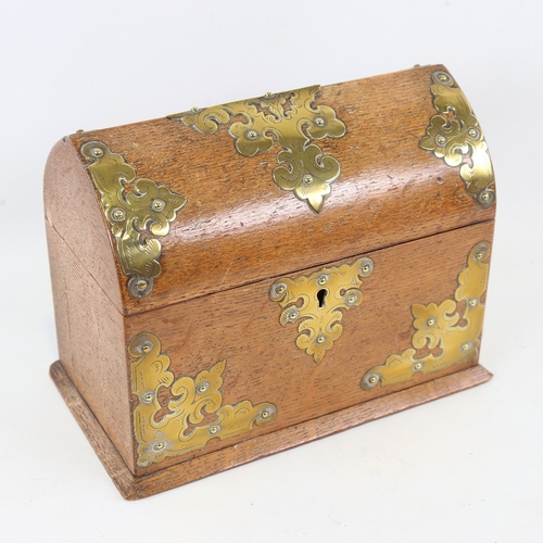 196 - A Victorian oak lancet-top casket, with engraved brass mounts and key, length 23cm, height 18cm