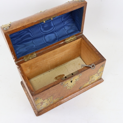 196 - A Victorian oak lancet-top casket, with engraved brass mounts and key, length 23cm, height 18cm