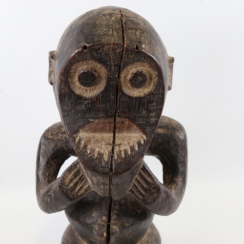 198 - An African carved and stained wood fertility figure, height 38cm, A/F