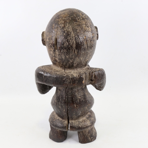 198 - An African carved and stained wood fertility figure, height 38cm, A/F