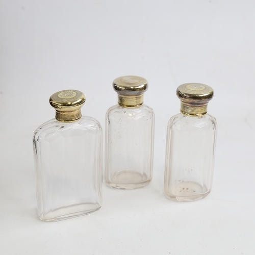 243 - A set of 3 Asprey's cut-glass and silver-gilt topped perfume bottles, hallmarks London 1910, largest... 