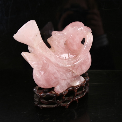 244 - A Chinese carved rose quartz bird on hardwood stand, overall height 16cm