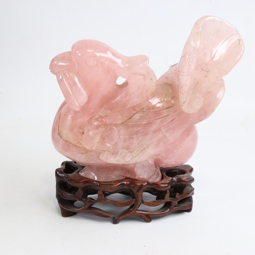 244 - A Chinese carved rose quartz bird on hardwood stand, overall height 16cm