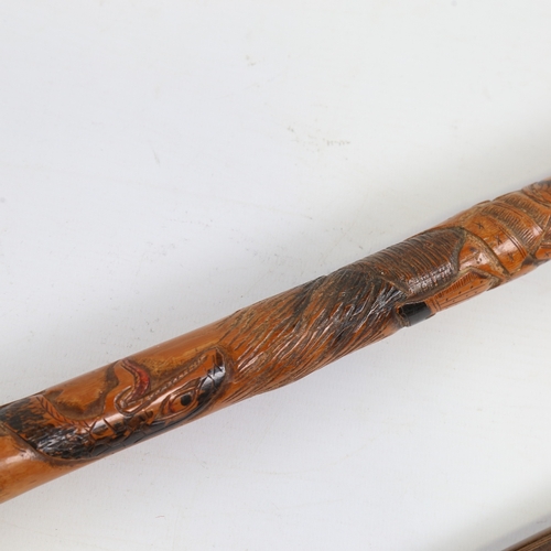 246 - A Japanese carved rootwood walking cane with later tip, and an ivory-handled walking cane with gilt-... 