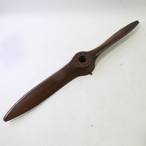 247 - A Vintage laminate wood aircraft propeller, with riveted metal edge, length 190cm (6'3