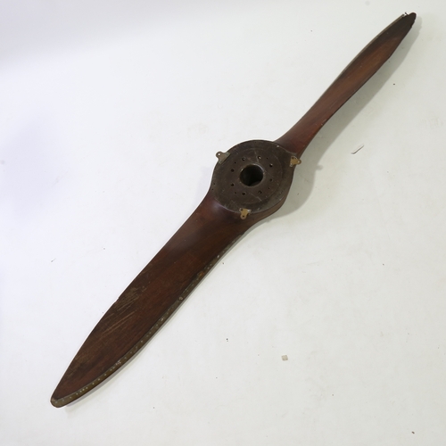 247 - A Vintage laminate wood aircraft propeller, with riveted metal edge, length 190cm (6'3