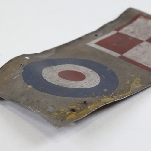 249 - A Vintage metal panel from a British Military aircraft, with painted insignia, 30cm x 15.5cm