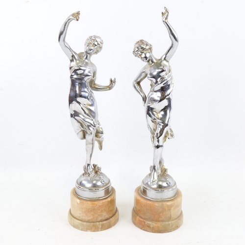 257 - A pair of Art Deco chrome plate spelter dancing girl figures on onyx bases, height 34cm