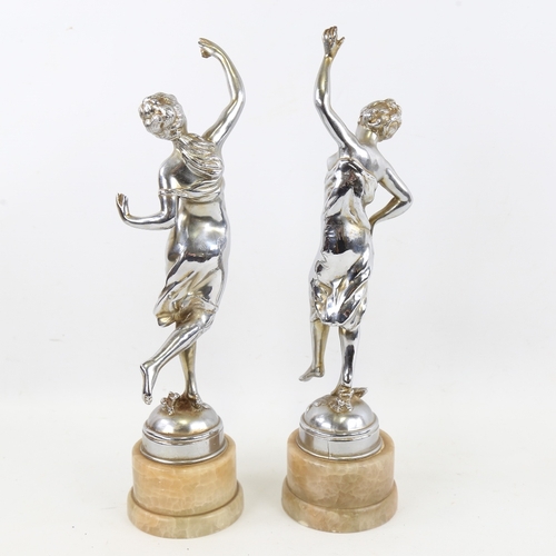 257 - A pair of Art Deco chrome plate spelter dancing girl figures on onyx bases, height 34cm