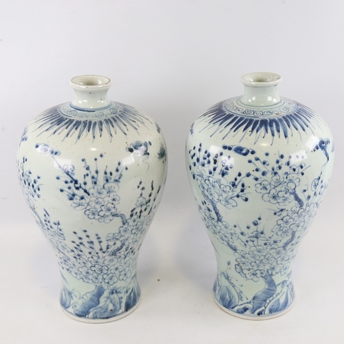 121 - A pair of Chinese blue and white porcelain narrow-neck jars, hand painted floral decoration, height ... 