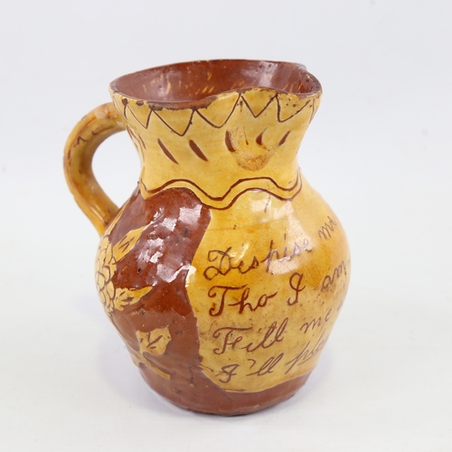 129 - FREMINGTON POTTERY (DEVON) - possibly by George Fishley, a pottery jug with text panel 