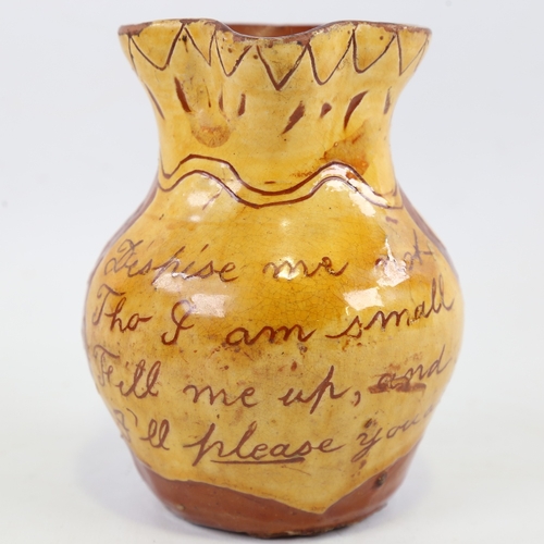 129 - FREMINGTON POTTERY (DEVON) - possibly by George Fishley, a pottery jug with text panel 