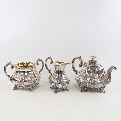 139 - An ornate 19th century electroplate 3-piece melon-shaped tea set, with chased relief floral designs ... 