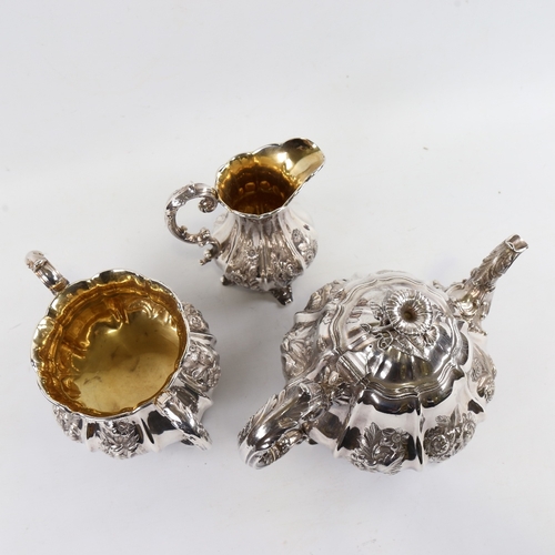 139 - An ornate 19th century electroplate 3-piece melon-shaped tea set, with chased relief floral designs ... 