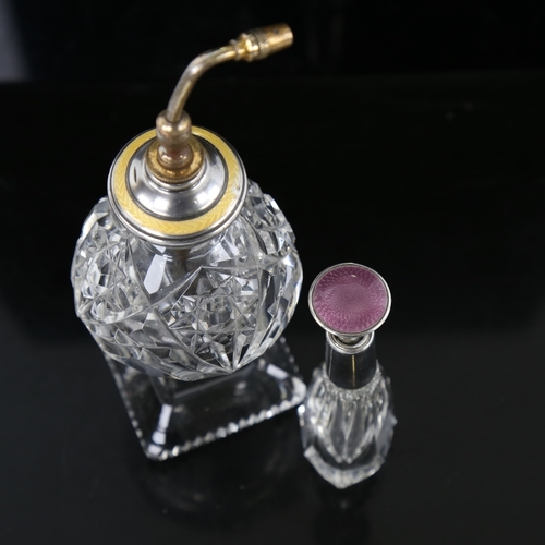 140 - 2 cut-glass silver and enamel-topped atomiser perfume bottles, largest overall height 17cm