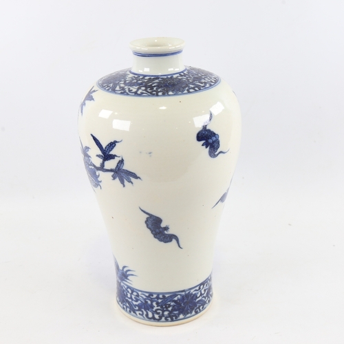 143 - A Chinese blue and white porcelain Mei Ping porcelain vase, hand painted fruit trees and bats, 4 cha... 