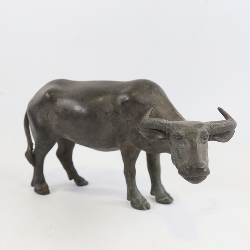 152 - A Chinese patinated bronze water buffalo, length 23cm, height 13cm